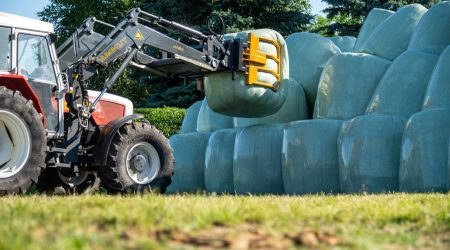 Round bale transport devices - Round bale clamp is ideal for stacking bales