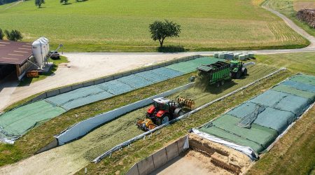 Silage spreader Mammut in use with grass silage